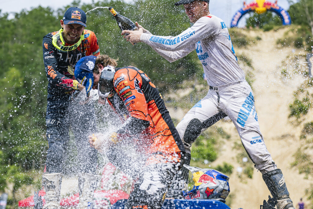 Manuel Lettenbichler (DEU) of the REDBULL KTM FACTORY RACING team first, Trystan Hart (CAN) of the FMF KTM FACTORY RACING second and Teodor Kabakchiev (BGR) of the ECONT team third, celebrate on the podium during the FIM Hard Enduro World Championship 2023 Stop 3 - Red Bull Romaniacs in Sibiu, Romania on July 29, 2023.